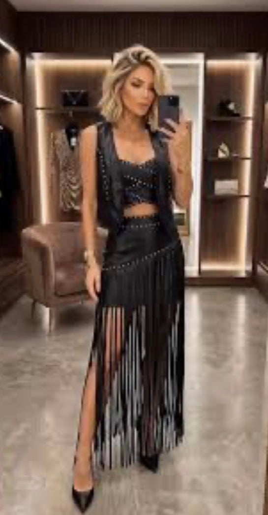 black faux leather maxi skirt with fringe detailing and stud embellishments