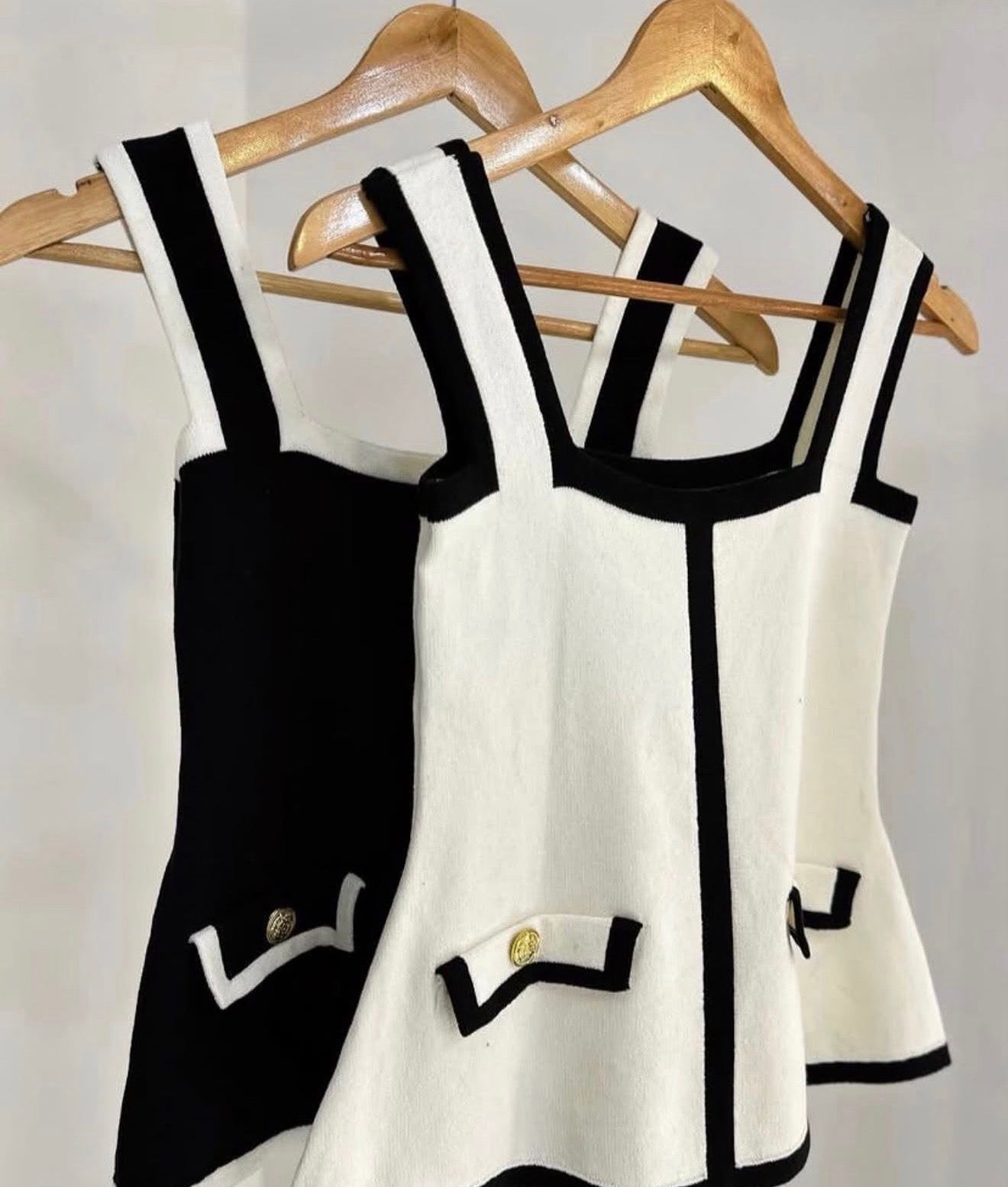 Black and white peplum skirt and blouse set with buttons