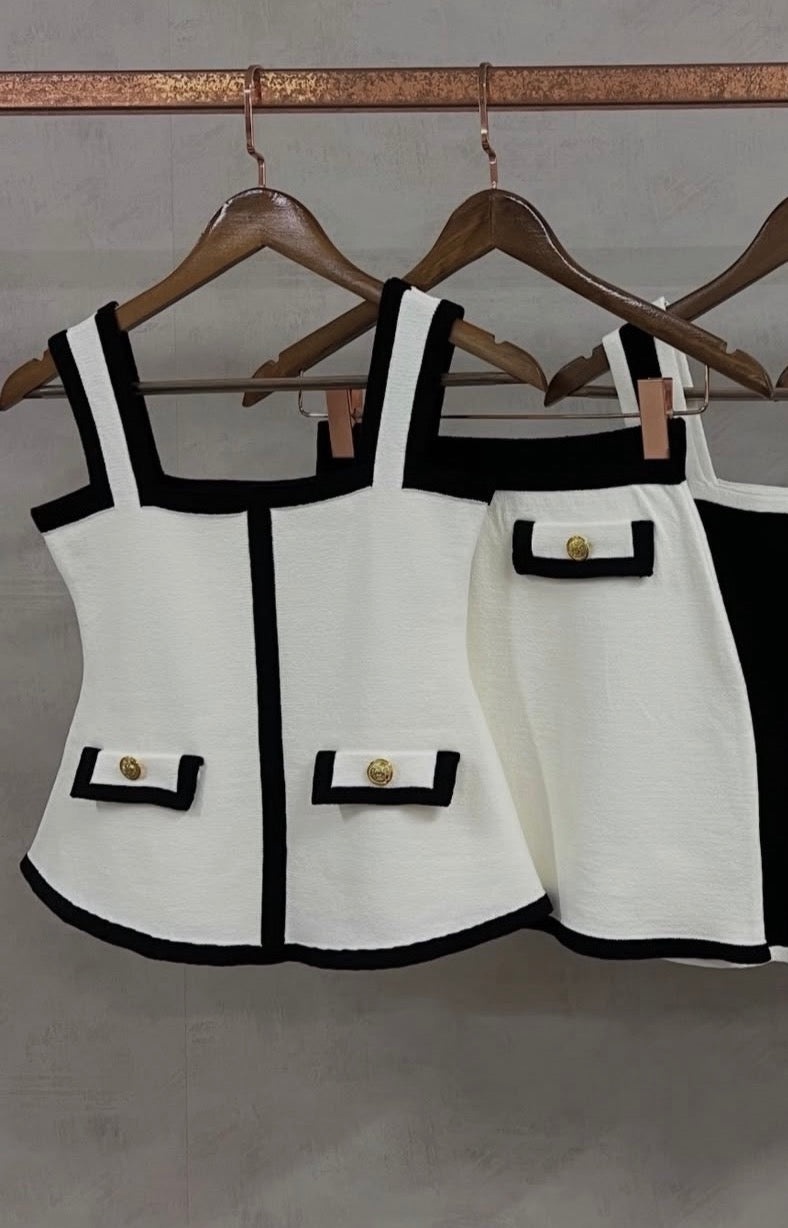 Black and white peplum skirt and blouse set with buttons